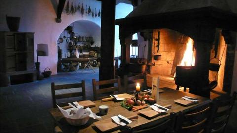 The medieval kitchen with the table set for dinner